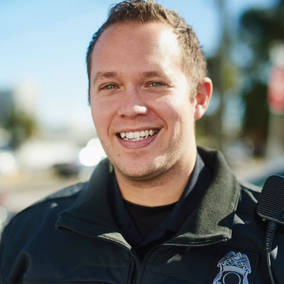 Police officer smiling at camera